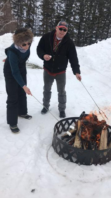Roasting marshmallows for a S'mores treat at Winterfest
