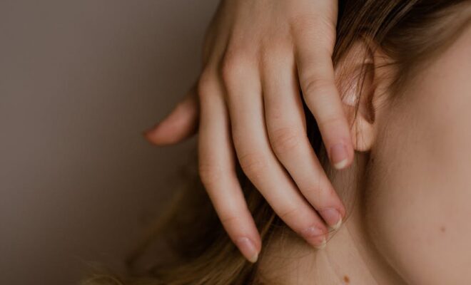 tender woman with birthmark on neck